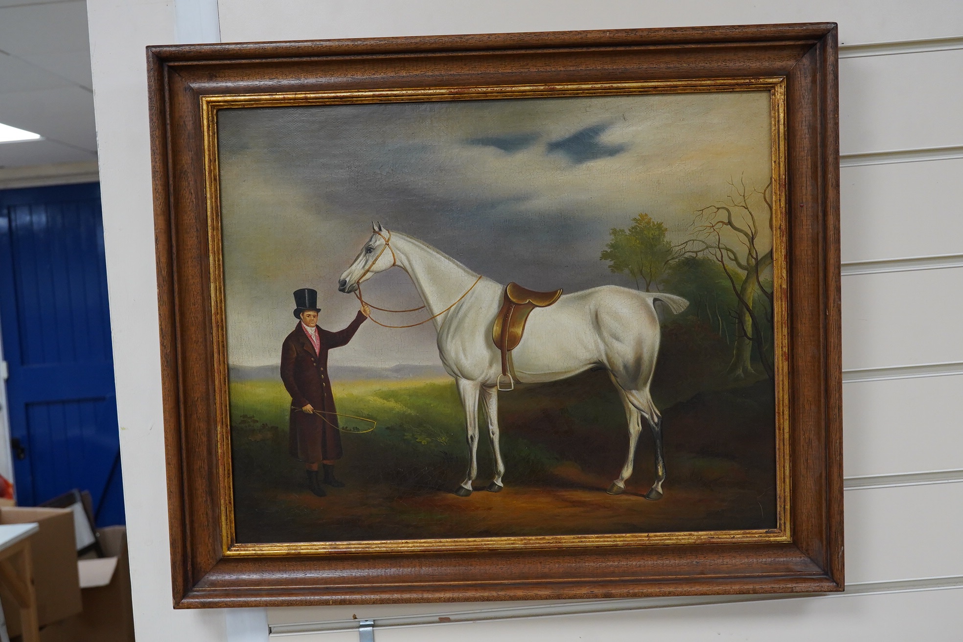 An early 19th century style oil on canvas, Study of a gentleman and saddled horse before a landscape, 39.5 x 49cm. Condition - fair to good